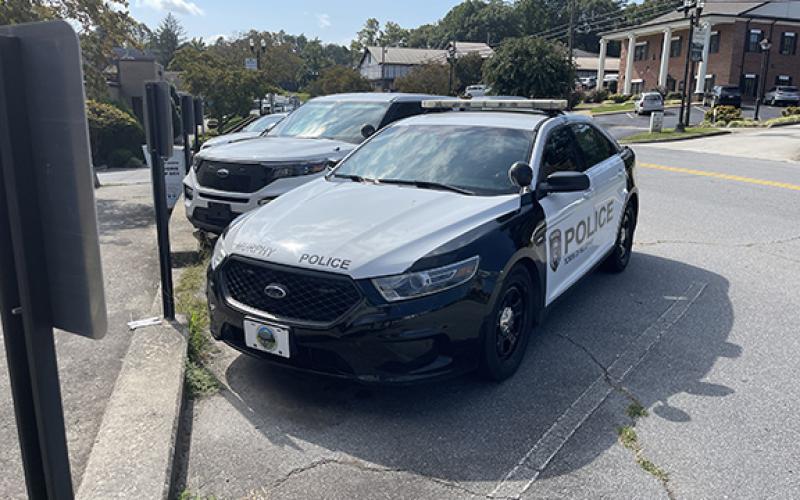 Randy Foster/editor@cherokeescout.com Police cars are parked outside the Murphy Police Department on a recent morning. Town officers are allowed to take their patrol cars home, one of many perks offered.