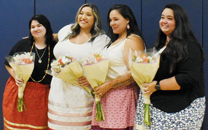 Dadiwonsi Language Program graduates stand in recognition at the end of the ceremony on Sept. 26. From left are Jazlyn “Wadulisi” McEntire, Cailon “Uwodsdi” Garland, Kirstie “Tsayga” Frady and Gina “Amage” Myers.