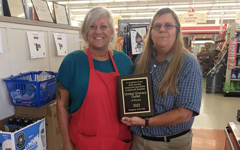 April Fleming and Brenda Cook (from left) accept the plaque recognizing United Grocery Outlet of Murphy as 2023 Employer of the Year.