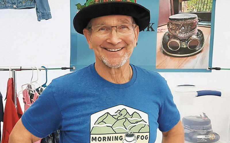 Anngee Quinones-Belian/ Staff Correspondent Curt Steinlage found his perfect Christmas hat during Christmas on Main festival on Nov. 18. Steinlage plans to open Morning Fog Coffee & Eats in Andrews inside the former Cole House restaurant.