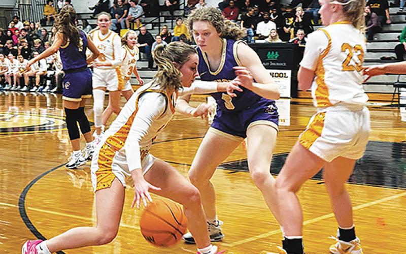 Photos by J.R. Carroll/Staff Correspondent Cayla Geer dribbles to get into scoring positon after a pick. 
