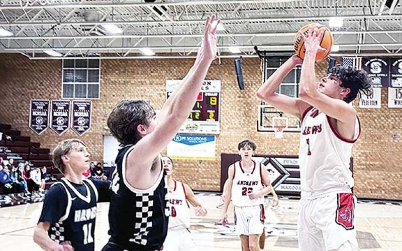 J.R. Carroll/Staff Correspondent Andrews’ Cam Rattler goes up for two points during the Swain County Christmas Tournament last week. The Wildcats’ boys team won both of their games.