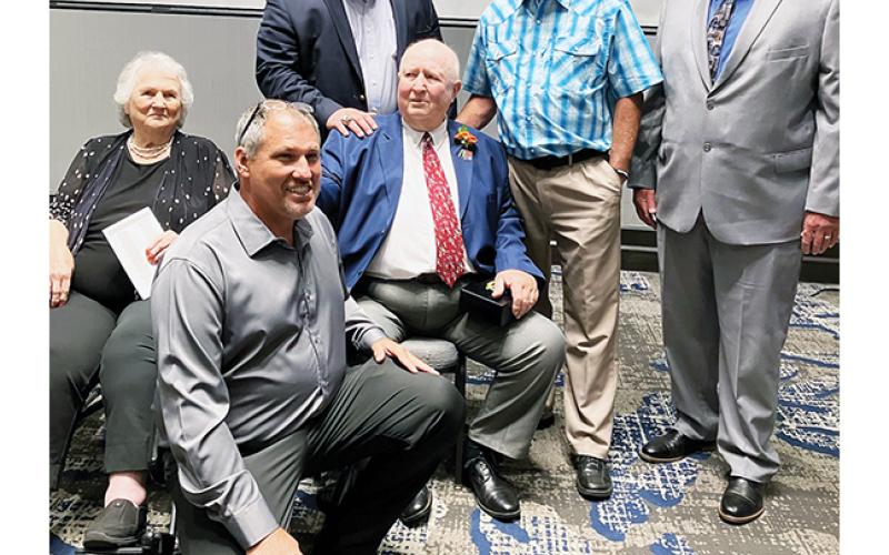 Longtime Swain County coach Boyce Dietz (sitting in middle) celebrates with his sister – along with Murphy coaches James Shope, Eric Brinke, Gary Thompson and Rick Hinke – during his N.C. High School Athletic Association Hall of Fame induction on Aug. 19, 2023.
