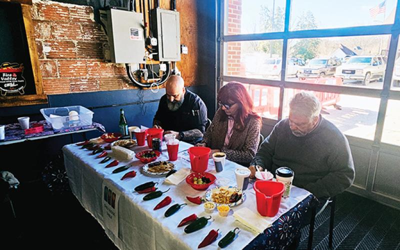 Volunteer chili cook-off judges included (from left) Chef Steven Lash of Sage restaurant, Cherokee County Commissioner Jan Griggs and Andrews Mayor James Reid.