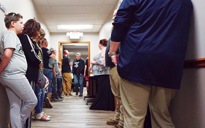 Parents attending Thursday night’s school board meeting were forced to stand in a hallway because of inadequate seating in the small room.
