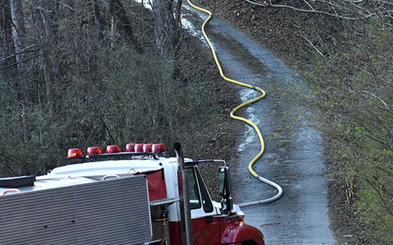 Photos by Randy Foster/editor@cherokeescout.com A long, narrow driveway complicated firefighting efforts during a house and woods fire at 41 Ramsey Estates in Murphy on Feb. 21.