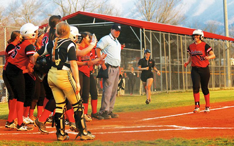 Photos by Cannon Crompton/sports@cherokeescout.com Pitcher Kinleigh Queen is met at home plate by her team after hitting a home run against Hayesville on Thursday.