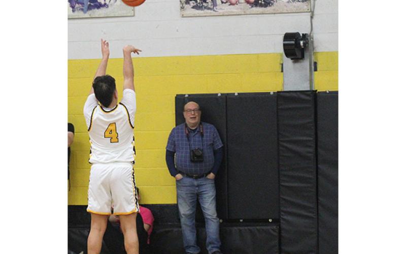 J.R. Carroll/Staff Correspondent Xander Wachacha shoots free throws in overtime Friday.