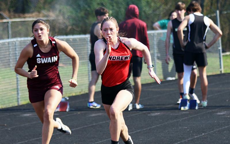 Andrews’ Kylie Donaldson (right) en route to her first-place finish in the 100-meter dash on March 20. 