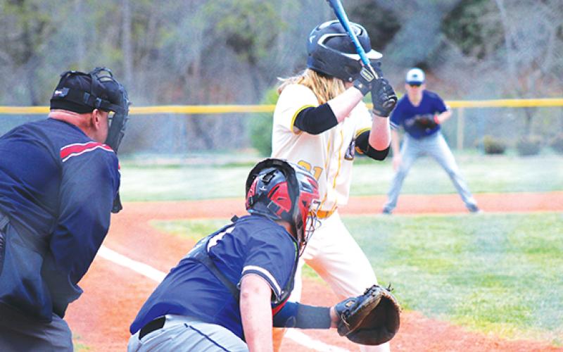 J.R. Carroll/Staff Correspondent Hiwassee Dam’s Trenten Beavers catches as Murphy’s Tommy Crapse hits on April 2.