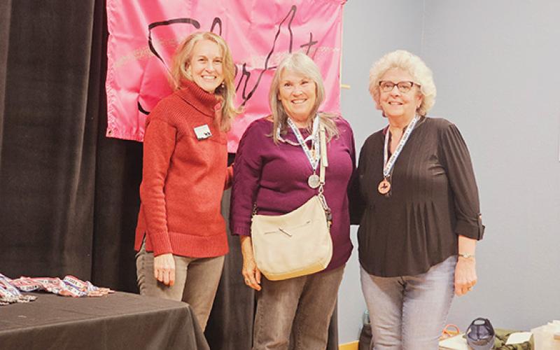 Winners in the Literary Essay category Jane Birchfield, with the gold medal for first place; and Tamara Phillips, taking bronze for third place; are shown with Beth Chaney (left), executive director of John C. Campbell Folk School, during the Cherokee/Clay County SilverArts ceremony Friday at the Cherokee County Arts Council.