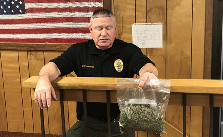Andrews Police Chief Michael Hobgood holds a bag of marijuana seized Thursday.