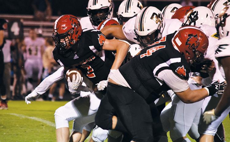 Andrews’ Landon White pops out of the pack on a fourth-down run to convert during Friday’s game against Rabun Gap.