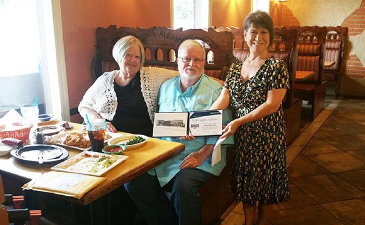 Mary and Andrew May (from left) are humbled with the Hometown Heroes award presented by Modern Woodman of America representative Linda May on Sept. 23 at Monte Alban in Andrews.