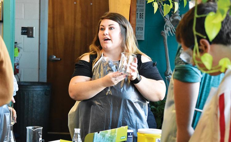 Avery Gibson instructs her Murphy High School students before beginning a lab experiment in her science class. Gibson has been named Cherokee County’s Teacher of the Year for 2019.