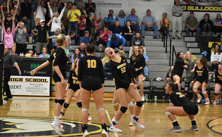 The Lady Dogs celebrate the match-winning point in their second round win over North Stanly. 
