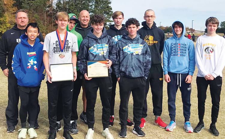 The Murphy boys cross-country team poses after their third-place performance at the state meet. Team members are (front row, from left) Richard Ly, Caleb Jones, Chase Pierce, Andrew Bryson; Back row are (from left) coach Davis Bryant, Clayton Laney, coach Frank Hill, Christian Tighe, Michael White, Caleb Rice and Tanner Roberts. Photo courtesy of Murphy High School