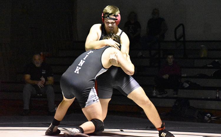 Andrews' Nick Graham puts Robbinsville's Kyle Fink in a head lock. Photo by Kevin Hensley.
