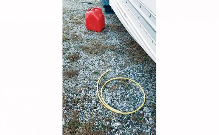 Gas thieves left behind this gas can and siphon hose following a heist at the U-Haul dealership in Andrews.
