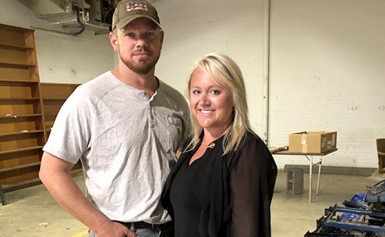 From left, Ryan and Holly Christy purchased the county’s former maintenance building, which is adjacent to the courthouse in downtown Murphy. Photo by Penny Ray