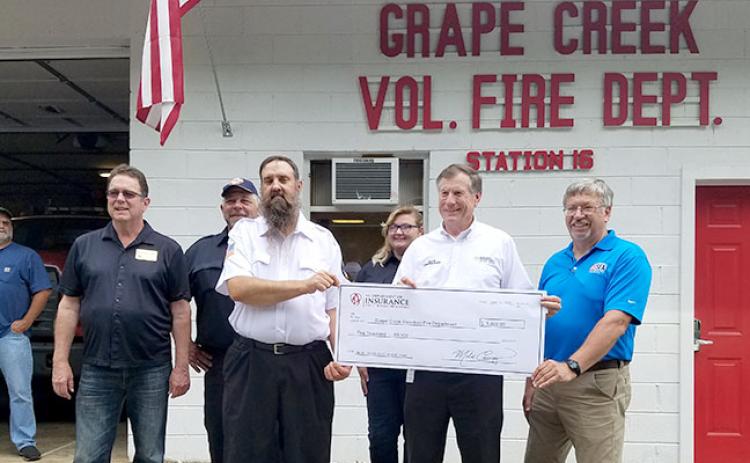 From left are state Rep. Kevin Corbin, Alan Andrews, Grape Creek Fire Chief Joe Lanphere, Rachel Lay, Commissioner Mike Causey and N.C. Firefighter Association financial director Dean Coward. Photo by Samantha Sinclair