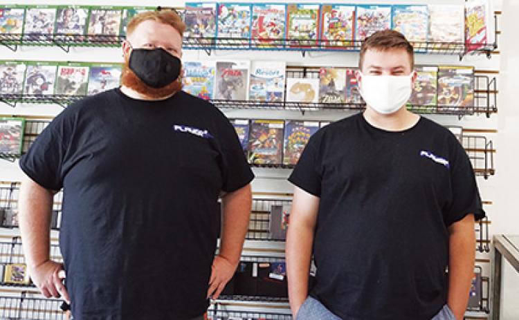 Local residents Dylan Winders (right) and Jonny Moore (left) have been collecting retro video games for years. They recently decided to open a retro game store dubbed Player 2 Gaming in Ranger. Photo by Noah Shatzer