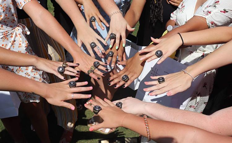 Photo by Dana Anderson: The Murphy Lady Bulldogs’ basketball team show off their state championship rings. 