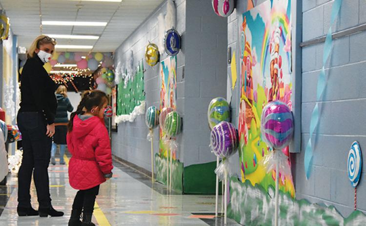 First-grader Hailey Lopez, a remote student at Andrews Elementary School, got to tour the school with her teacher, Sandy Faggard, on Dec. 16 and see her school decorated as Candy Land. Photo by Samantha Sinclair