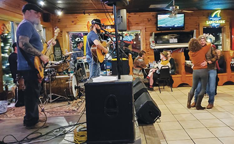 Photos by Samantha Sinclair/scoutingaround@cherokeescout.com The Andrew Chastain Band performs at Chevelles Restaurant & Bar in Murphy.