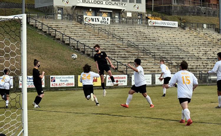 Murphy' Drake Fowler launches himself through the air to attempt a header off of a corner kick. 