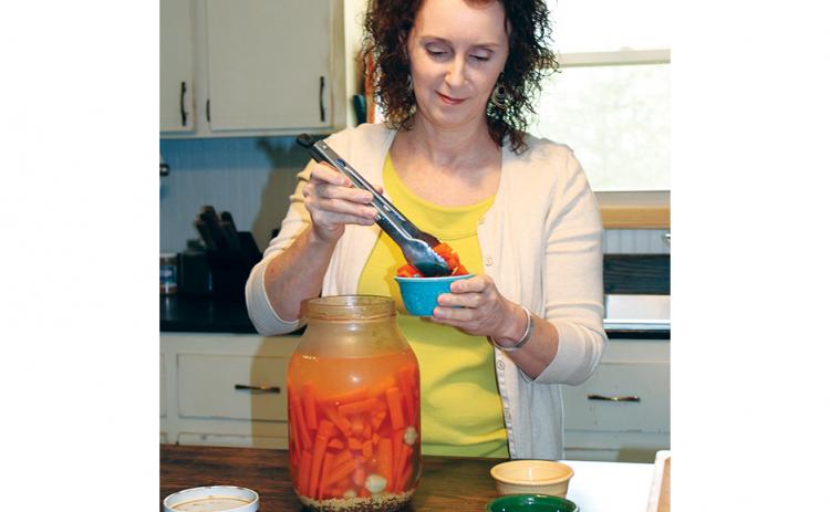 Stacy Van Buskirk/svanbuskirk@cherokeescout.com Many traditional Appalachian meals are prepared in Tipper Pressley’s kitchen in Brasstown, like these fermented carrots. She writes about traditional meals on her blog, “Blind Pig and the Acorn.”