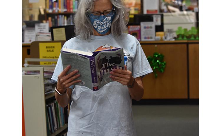 Laurie Phillips of Murphy was happy to return to the local library after it reopened on March 8.