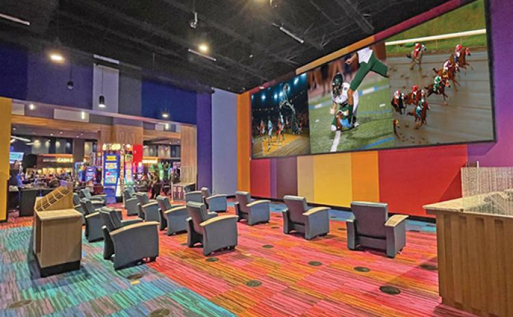 Penny Ray/pennyray@cherokeescout.com The sports book, officially known as The Book, opened in Harrah’s Cherokee Valley River Casino & Hotel in Murphy last week. 
