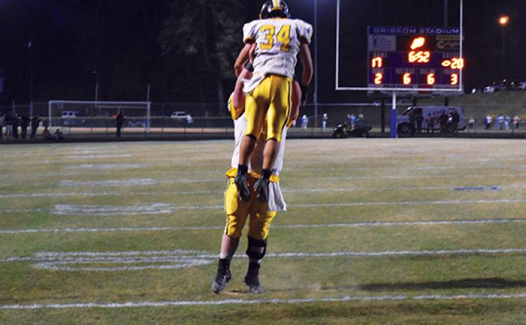  Justin Fitzgerald/sports@cherokeescout.com Murphy running back Ty Laney is lifted high into the air after scoring a touchdown during Murphy’s 29-24 win over Elkin. The Bulldogs will take on Robbinsville this Friday night, with the winner advancing to the state 1A championship game.