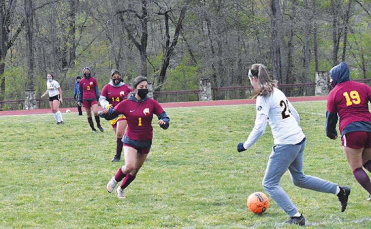 Justin Fitzgerald/sports@cherokeescout.com Murphy freshman Lailee Hollaway looks to dribble around a Cherokee defender during the Lady Bulldogs’ 7-0 win over Cherokee on April 21. Holloway scored five goals in the game.