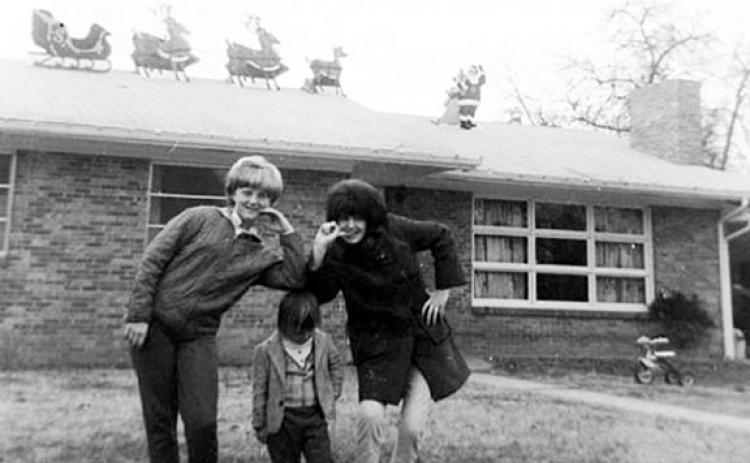 This is the picture of the home Ruby and Harold Curtis built on Happy Top in 1958. In the photo (from left) are Freida Ladd, a neighborhood friend, Marilyn Curtis and Steve Curtis (front).   