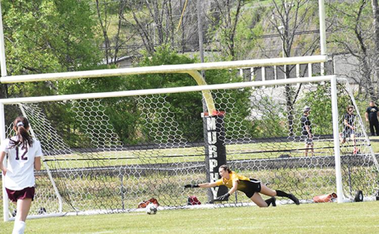 Justin Fitzgerald/sports@cherokeescout.com Murphy goalie Torin Rogers dives for the ball during the Lady Bulldogs’ 5-1 loss to Swain County on Friday afternoon.