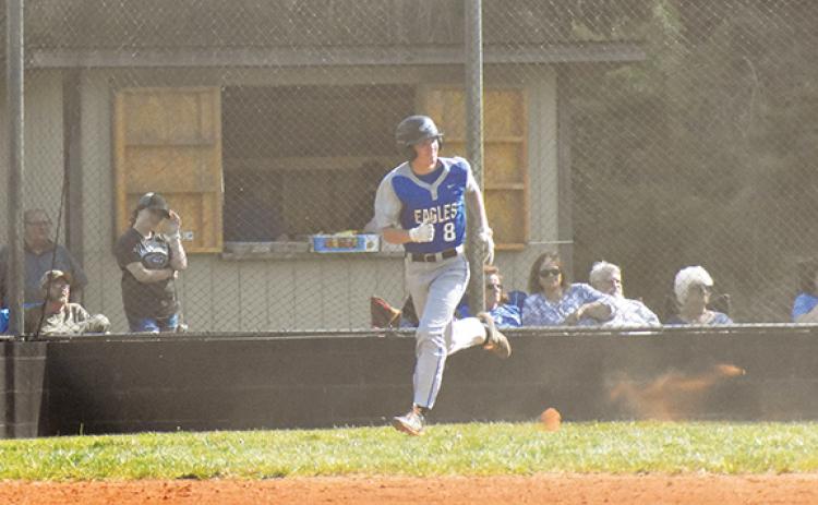 Hiwassee Dam’s Clay Davis legs out a base hit during the Eagles’ 10-9 win over Robbinsville on April 27.