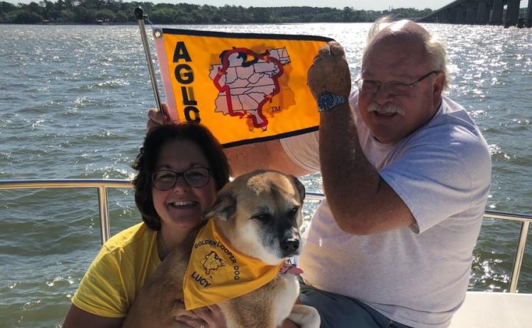 Theresa Gaffney (left), Tim Gaffney and their dog, Lucy, during their 2018 Great Loop expedition, circumnavigating the eastern half of the United States by boat. Tim Gaffney recently died after a lengthy battle with COVID-19 complications.