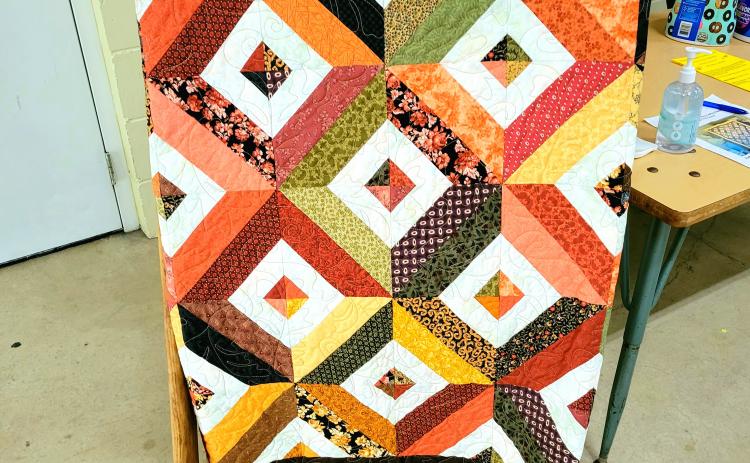 This quilt will be raffled off to raise funds for the Brasstown Community Center until Thanksgiving when the winner will be announced during the Brasstown Community Center Thanksgiving Potluck. Raffle tickets are $1 for 1 ticket or 6 for $5 and will be available for purchase at Carolina Crafting in Murphy.