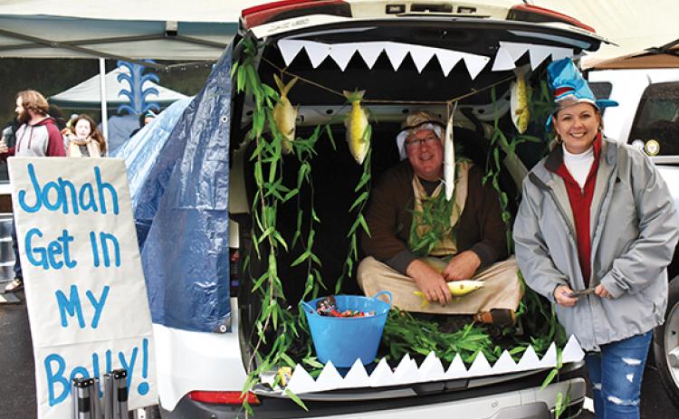 Bob and Temple Weinkle tell the story of Jonah and the whale while passing out treats.