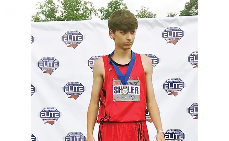 Angie Shuler/ Contributing Photographer Andrews eighth-grader Logan Shuler took first in the high jump at the NCRunners Middle School Elite Invitational 2022 on May 6. His jump of 5 feet, 9 inches, was a new school record in the event.