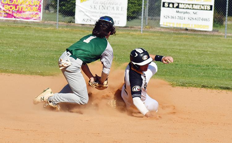 Justin Fitzgerald/sports@cherokeescout.com Murphy’s Kellen Rumfelt tries to avoid the tag of Eastern Randolph’s Alex Kivett during the Bulldogs’ 6-1 loss to the Wildcats on May 10.
