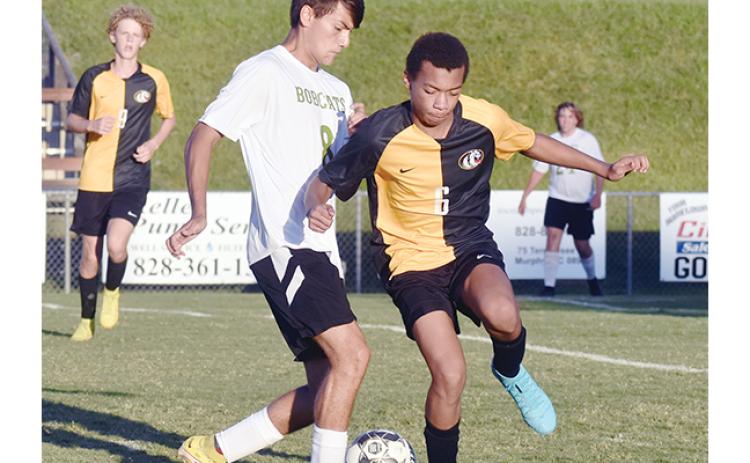 Justin Fitzgerald/sports@cherokeescout.com Murphy’s Keishon Oliver tries to get the ball away from Blue Ridge’s Isaiah Palestino during the Bulldogs’ 4-0 loss to the Bobcats on Sept. 14.