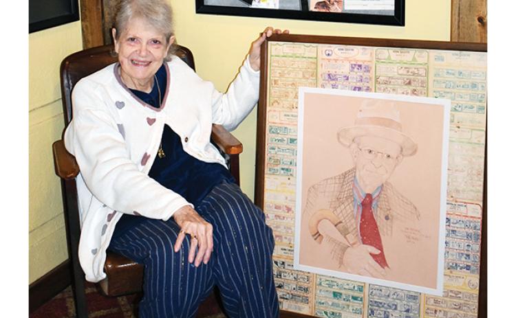 Anngee Quinones-Belian/Staff Correspondent  Betsy Henn Bailey’s love for her father, P.J. Henn, prompted her to paint a portrait of him, which she gifted to the iconic Henn Theatre in downtown Murphy.