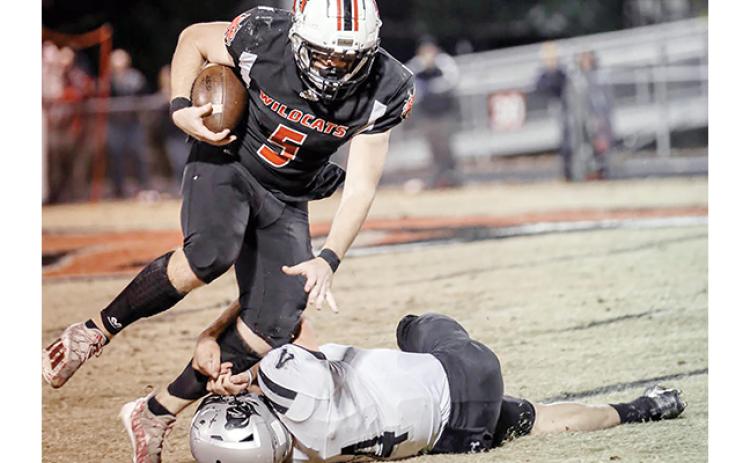 Haley Coffey/Contributing Photographer Andrews’ Austin Martin tries to shake off Robbinsville’s Cuttler Adams during the Wildcats’ 28-12 win over the Black Knights. Martin had 164 yards of offense and two touchdowns in the win, which was Andrews’ first over Robbinsville since 1998.