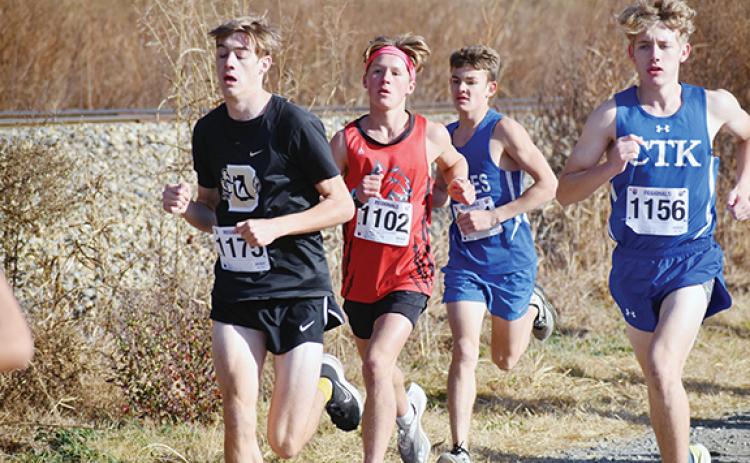 Justin Fitzgerald/sports@cherokeescout.com Andrews O’Malley Salinas (in red) took first in the 1A West Regional Championship on Saturday. Salinas will run again during this Saturday’s state meet, as will Hiwassee Dam’s Ethan Russell, who is just behind Salinas at this point in the race.