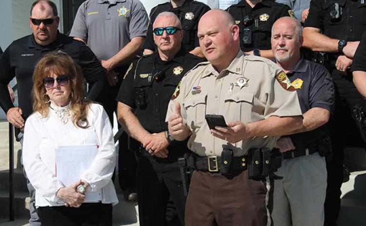 Larry Griffin/lgriffin@thesmokymountaintimes.com Ellen Pitt, head of WNC’s MADD chapter (left), stands with law enforcement as Lt. David Williams of the Cherokee County Sheriff’s Office speaks about various bills concerning drunk or impaired driving on April 20.