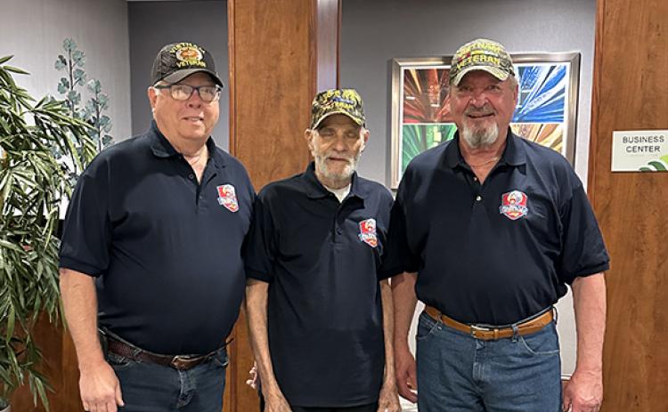 Bob Strawhecker, Oscar Valdes and J.D. Baker pose for a photo on April 29, when they participated in an Honor Flight tour of Washington.