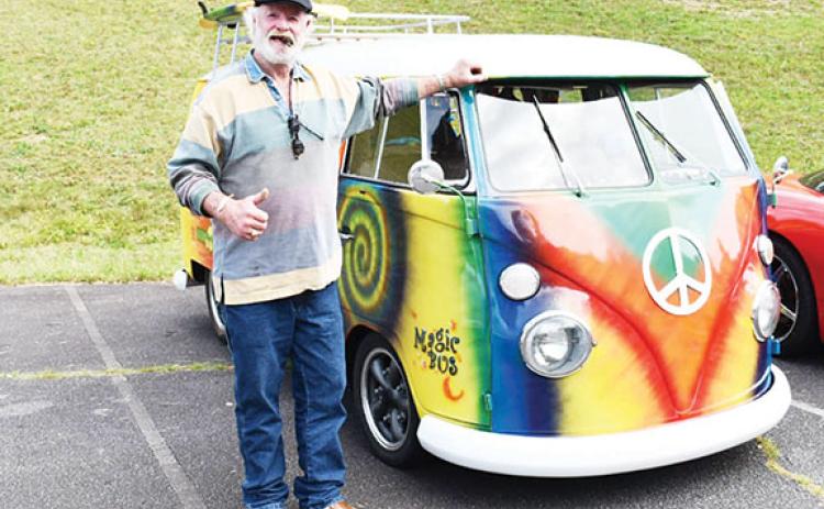 Bill Belian/Contributing Photographer  A brightly colored 1964 VW Bus owned by Pete Van Rossum was a hit. He was more than happy to tell folks about his hippy-style mode of transportation.